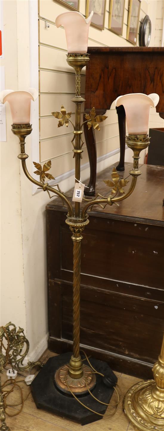 A late 19th century brass Ecclesiastical 3 light candelabrum, fitted with later pink glass shades W.54cm